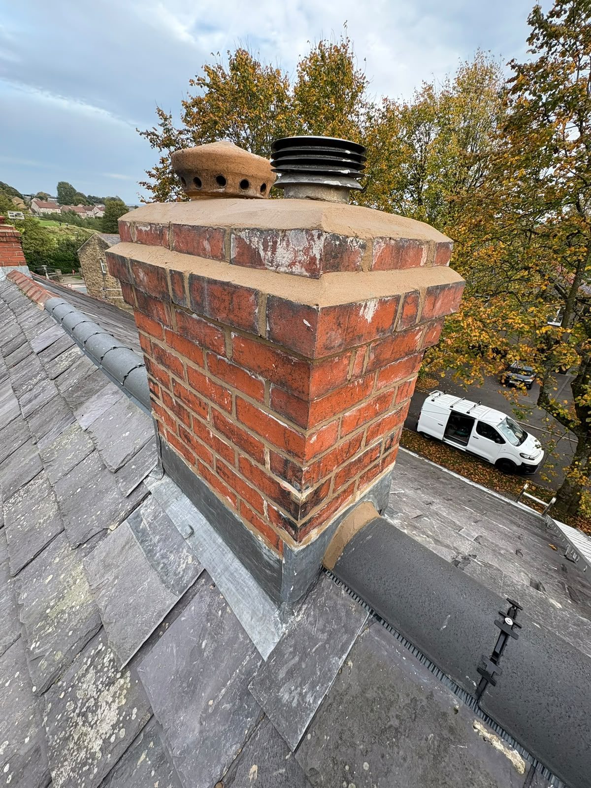 Red brick chimney stack rebuilt and fitted with new lead flashing by SW Roofing in Lancashire